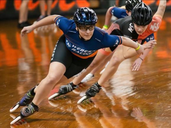 Westfield State student Jeilyn Godin skates in an inline speed skating race.