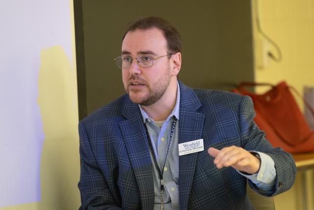 Faculty member Nicholas Morrison lecturing in classroom.