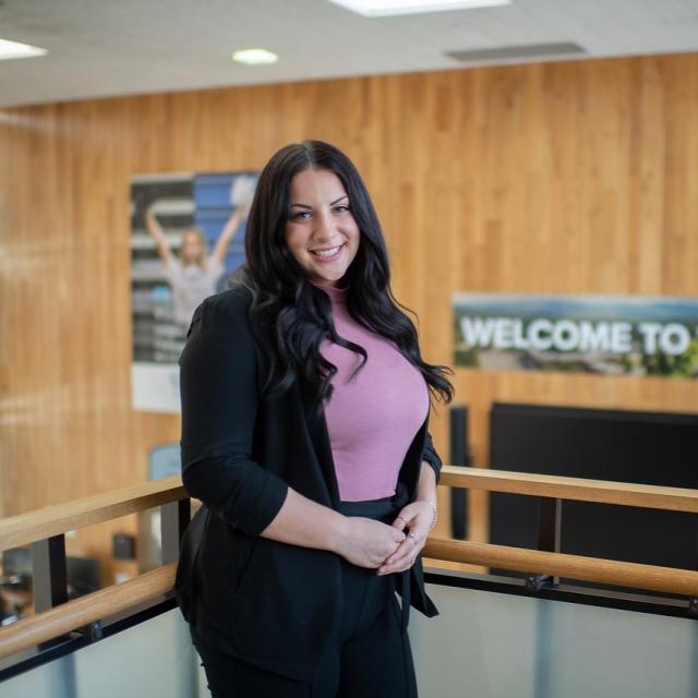 School counseling graduate student smiling in the Horace Mann Center.