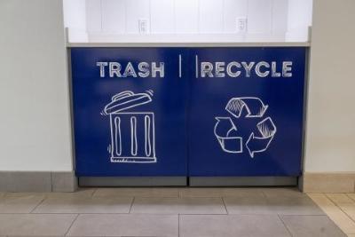 Blue trash and recycling bins.