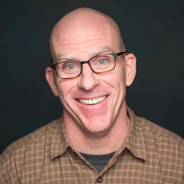 David Shapleigh, Chair of Westfield State University’s Art Department, smiles while posing for a portrait photo.